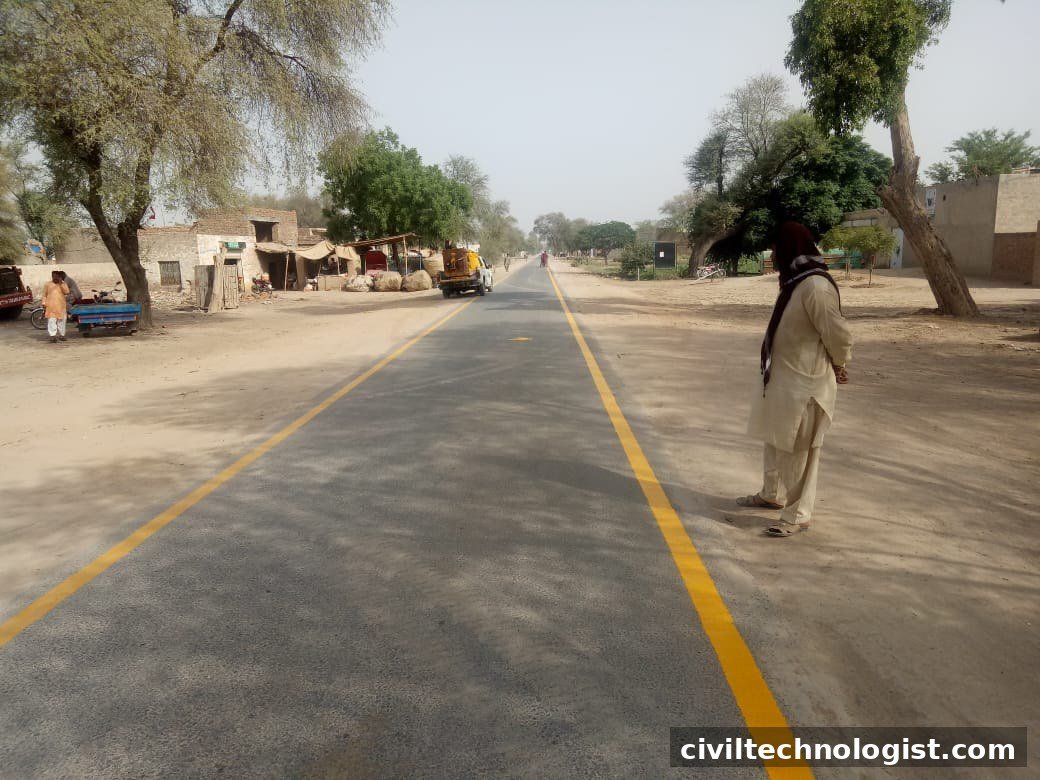 Completed asphalt road with yellow centre-line markings on a curve