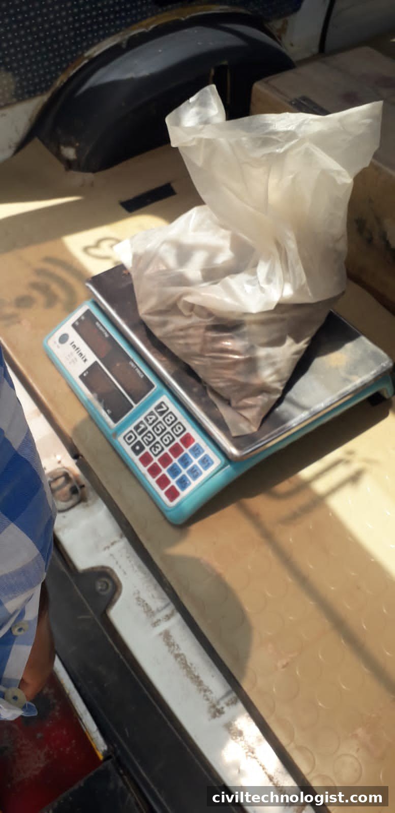 Weighing a cement sample on a laboratory scale