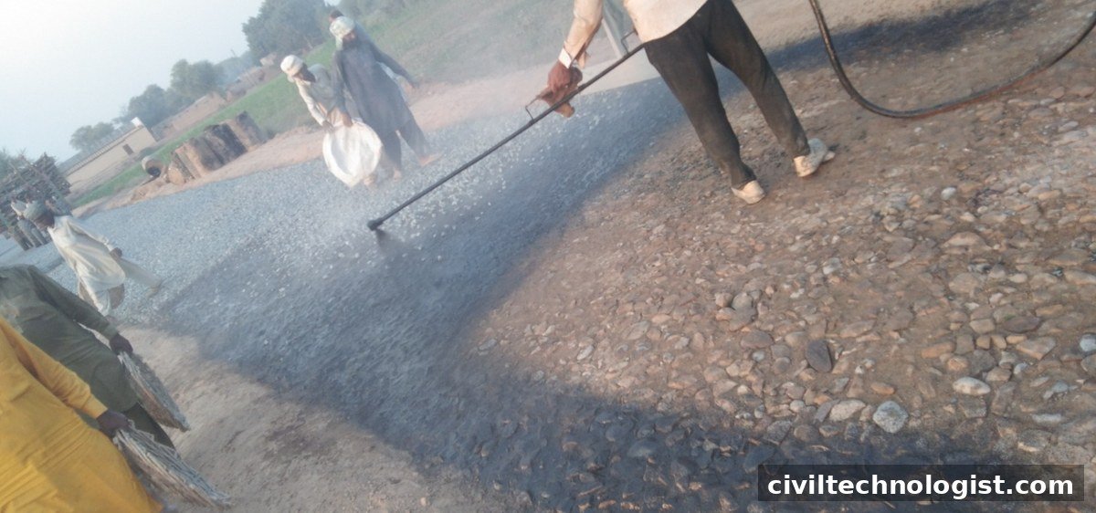 Bitumen spraying over aggregate during triple surface treatment